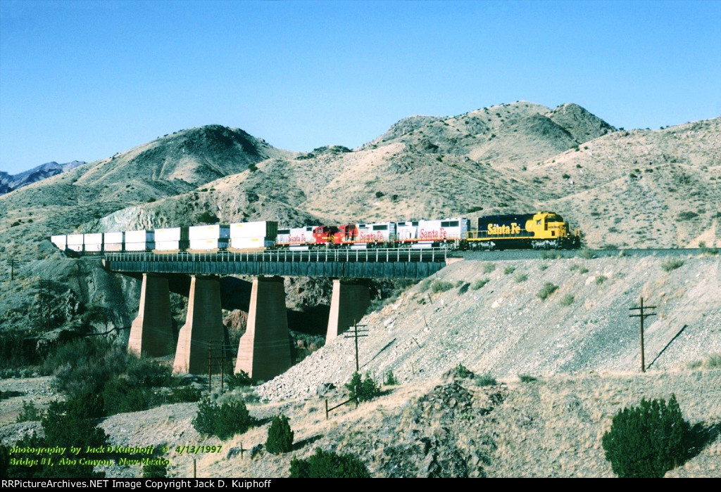 AT&SF, Santa Fe SD40-2 5075 leads 330-153-202 with an eastbound over bridge #1, into Abo Canyon, Sais, New Mexico. April 14, 1997. 